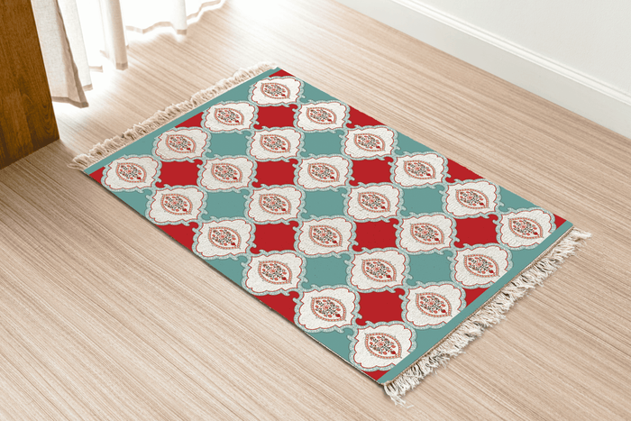 Angled view of the checkerboard floral medallion Dhurrie rug on a wood floor near a curtained doorway