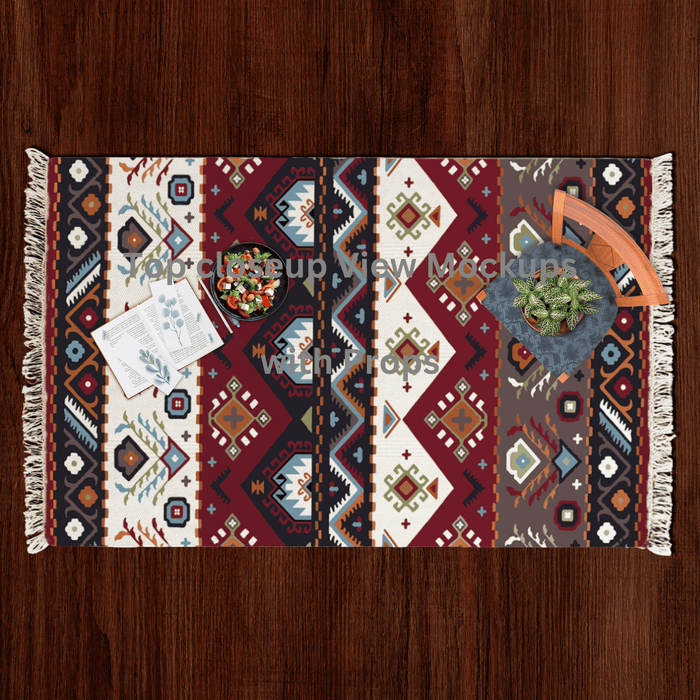 Top-down flat lay of the southwestern geometric diamond Dhurrie rug styled with a salad bowl, notecards, and a potted plant