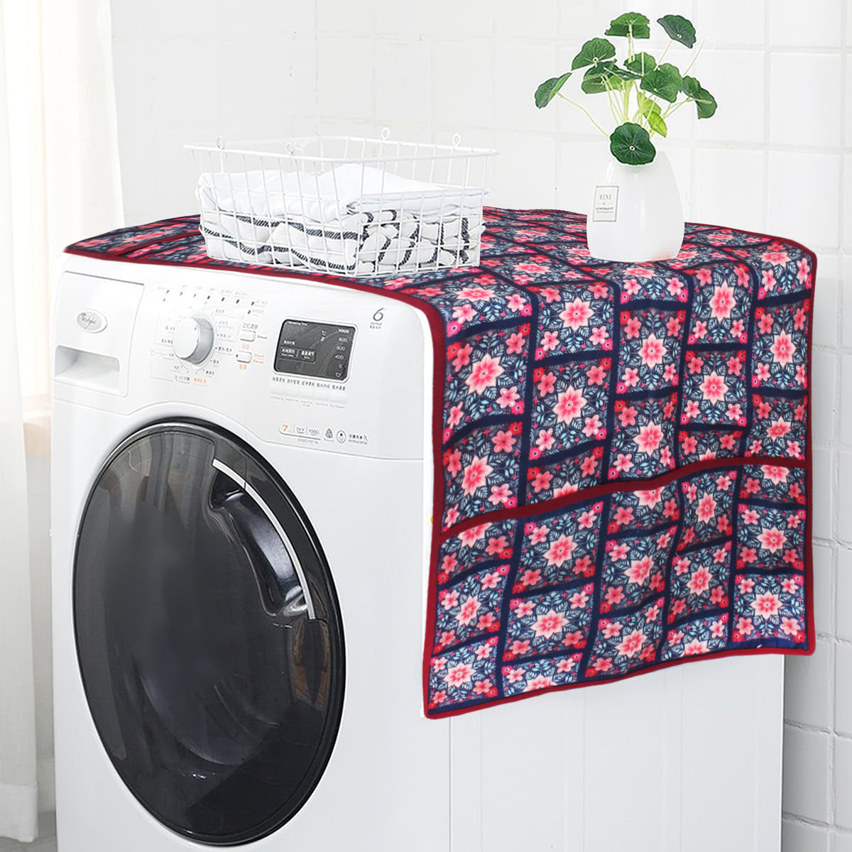 Pink and white floral tile print fridge cover draped over the top of a washing machine