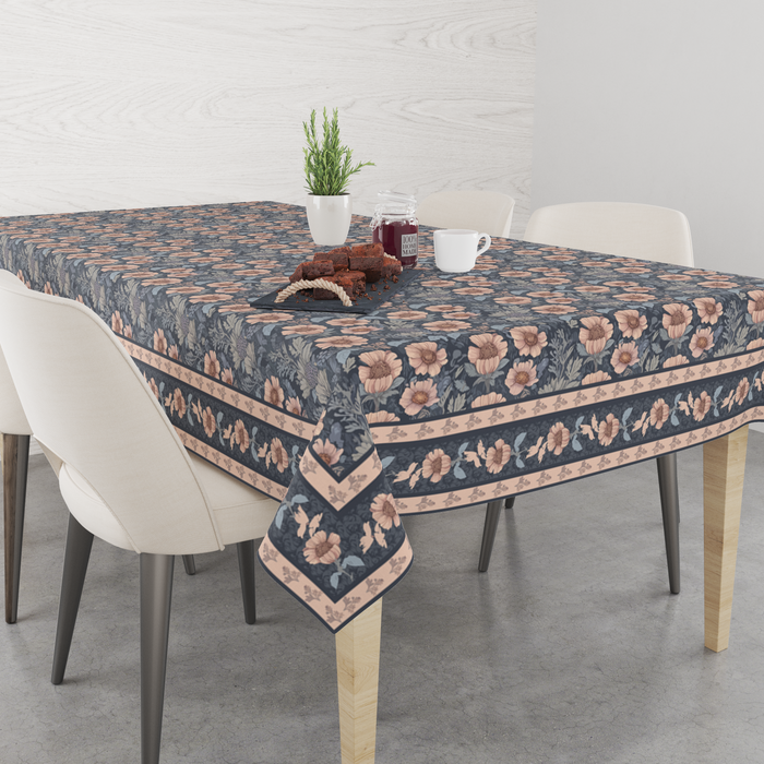 Navy-blue tablecloth with a dusty-pink floral print, matching border trim, shown top-down on a dining table