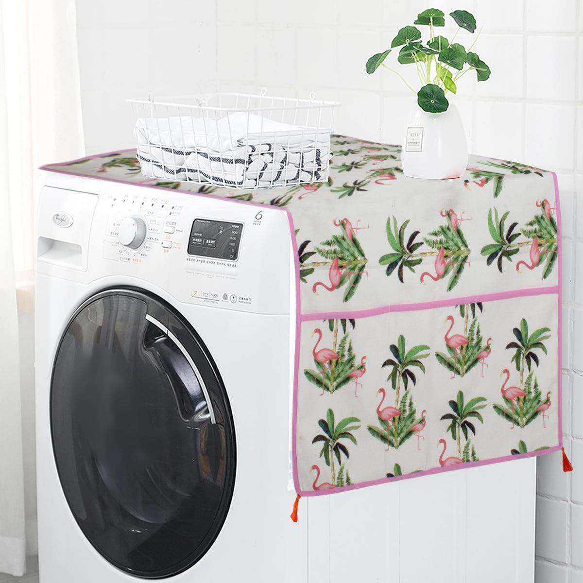 Flamingo and tropical palm leaf print cover draped over the top of a washing machine