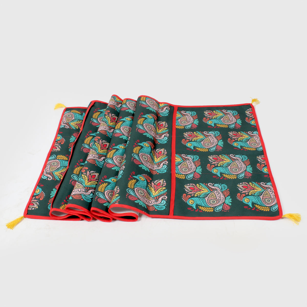Peacock-paisley print fridge cover shown fully unfolded with red trim and yellow tassels