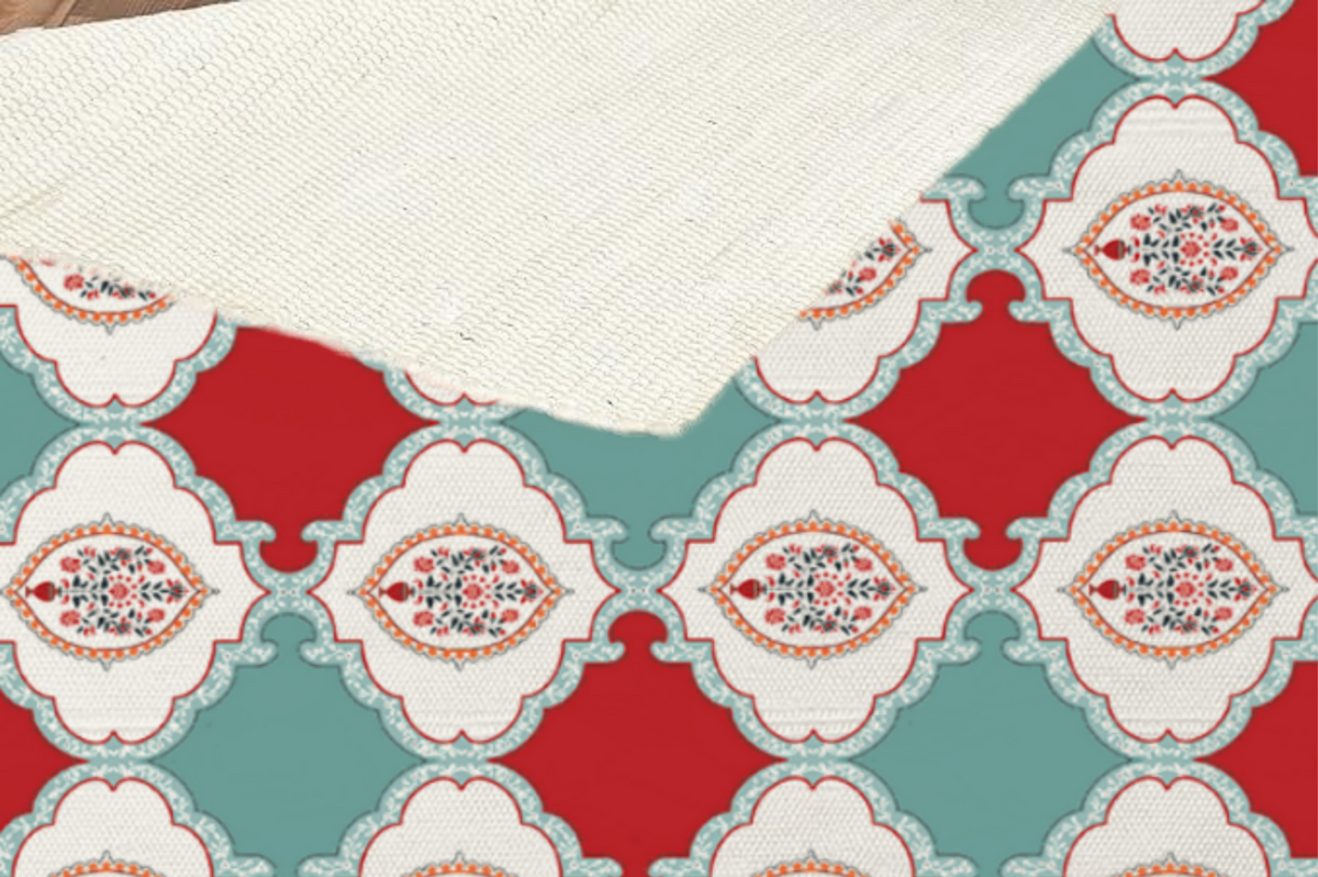 Close-up of a folded-back corner showing the woven texture and underside of the checkerboard floral medallion Dhurrie rug