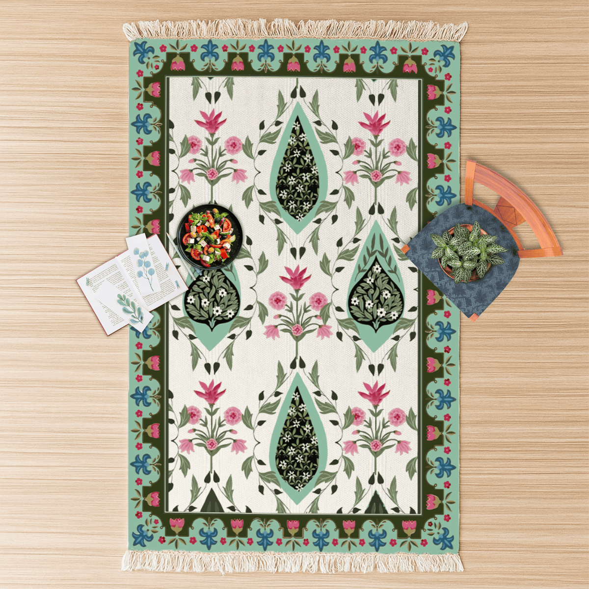Overhead flat lay of the paisley medallion Dhurrie rug with a snack bowl and a small houseplant on top