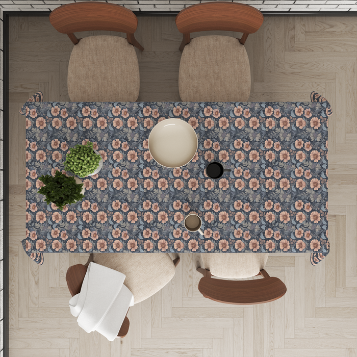 Navy-blue tablecloth with a dusty-pink floral print, matching border trim, set on a 6 seater dining table with matching chairs