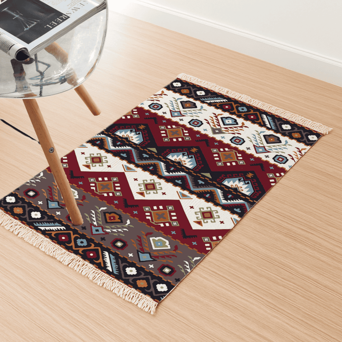 Angled view of the southwestern geometric diamond Dhurrie rug on a light wood floor beside a chair