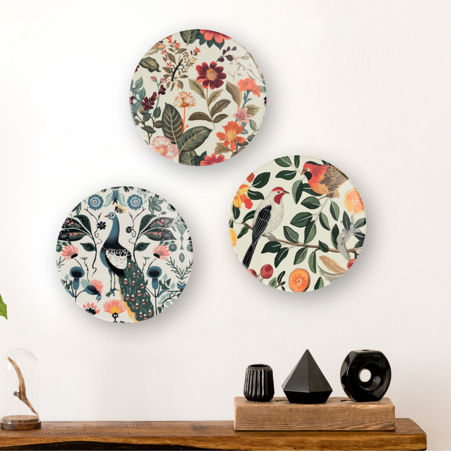Set of 3 round MDF wall plates with floral, peacock and bird print, mounted above console table