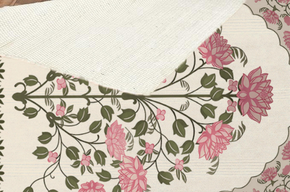 Close-up of a folded-back corner showing the woven texture and underside of the rose bouquet floral medallion Dhurrie rug