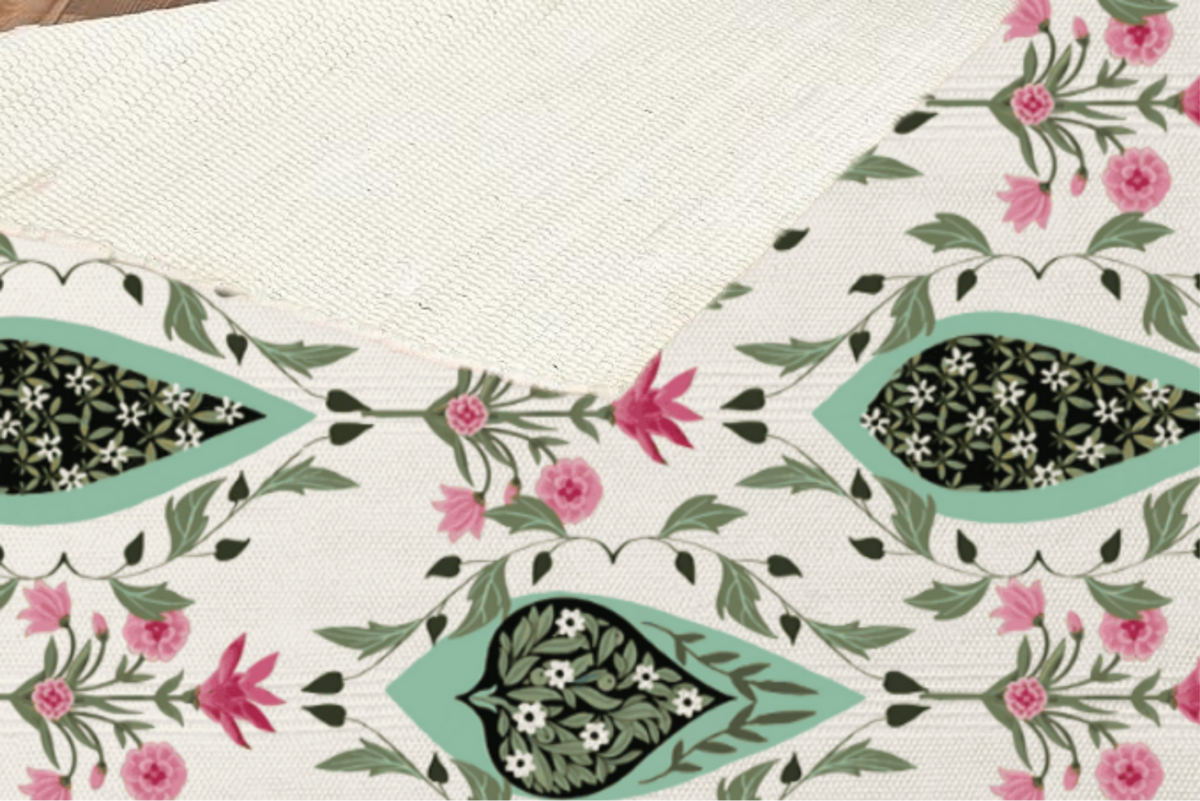 Close-up of a folded-back corner showing the woven texture and underside of the paisley medallion Dhurrie rug