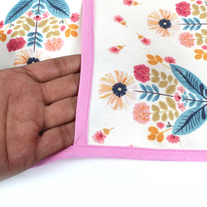 Close-up of a hand feeling the fabric of the floral bouquet print fridge cover